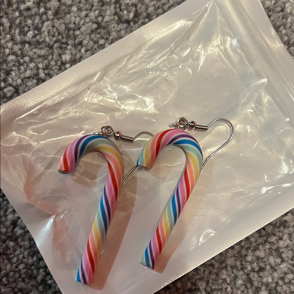 New no tags Christmas candy cane earrings.